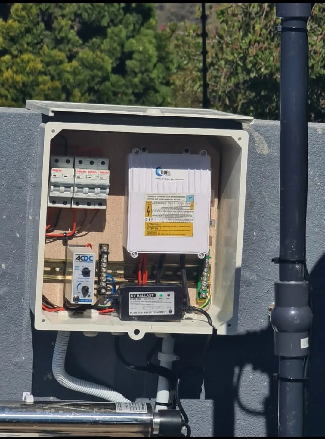 Open pump control box with breakers and pump controller